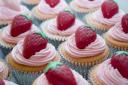 Strawberry Cupcakes with Strawberry icing and Vanilla flavored candy strawberries, hand-painted and individually molded