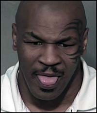 Mike Tyson says "Pfffttttth!" for the mugshot at Maricopa County Jail.