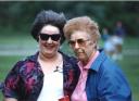 Daughter Mary goofs off with her mother Mary at a family reunion