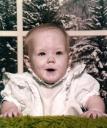 Jessica smiles at about six months of age