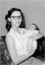 Holding her son, Douglass in 1952