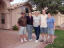 The Green family poses outside the Chandler house
