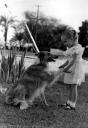 Karen stands with her dog Lassie